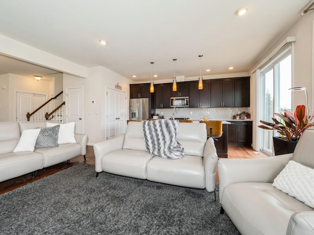 57 Lewis Rd, Hopewell Junction, NY 12533 - living room featuring light wood finished floors, stairway, and recessed lighting