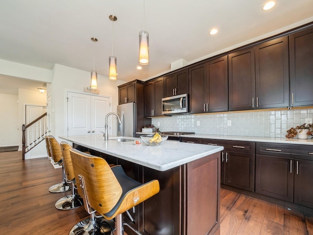 57 Lewis Rd, Hopewell Junction, NY 12533 - kitchen with appliances with stainless steel finishes, tasteful backsplash, dark wood-style flooring, and recessed lighting