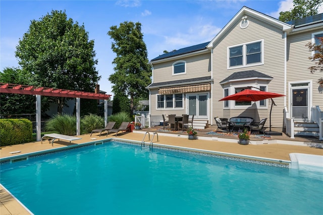 565 S 8th St, Lindenhurst, NY 11757 - outdoor pool featuring entry steps, a patio, and french doors