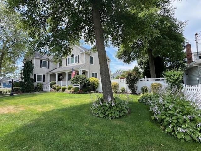 565 S 8th St, Lindenhurst, NY 11757 - view of front facade with covered porch