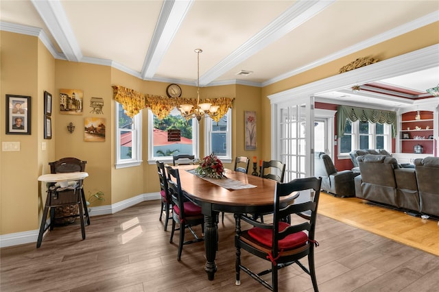 565 S 8th St, Lindenhurst, NY 11757 - dining area with a chandelier, wood finished floors, plenty of natural light, crown molding, and beam ceiling