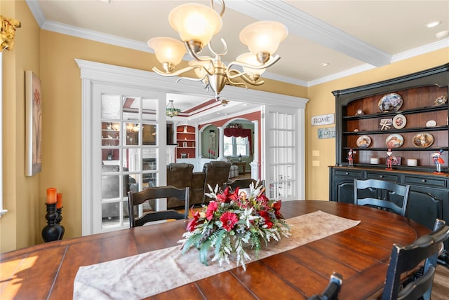 565 S 8th St, Lindenhurst, NY 11757 - dining room featuring a chandelier and ornamental molding