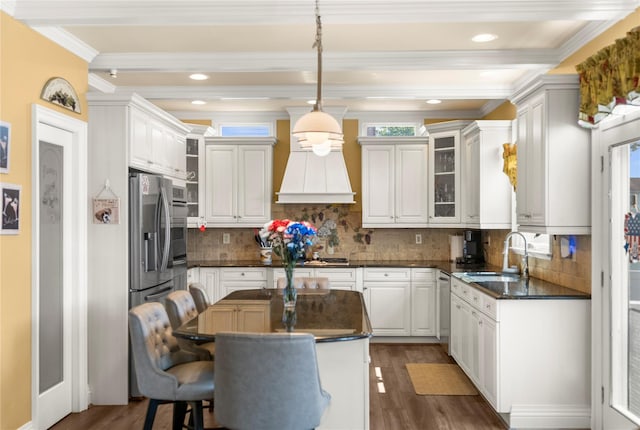 565 S 8th St, Lindenhurst, NY 11757 - kitchen featuring dark countertops, crown molding, wood finished floors, beamed ceiling, and decorative backsplash