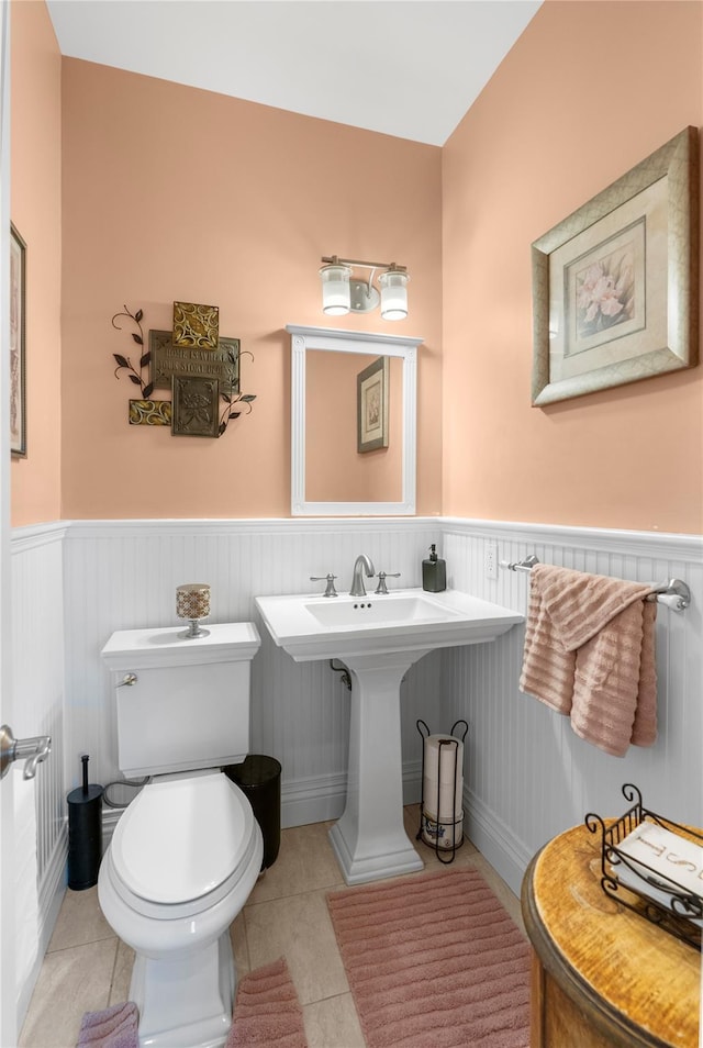 565 S 8th St, Lindenhurst, NY 11757 - half bath featuring wainscoting and tile patterned flooring