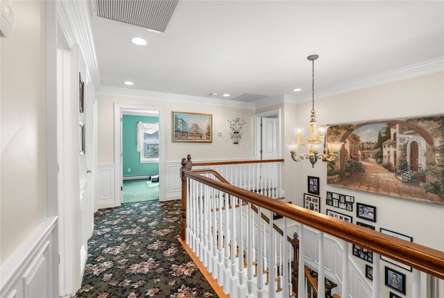 565 S 8th St, Lindenhurst, NY 11757 - corridor with an upstairs landing, dark colored carpet, recessed lighting, crown molding, and a chandelier
