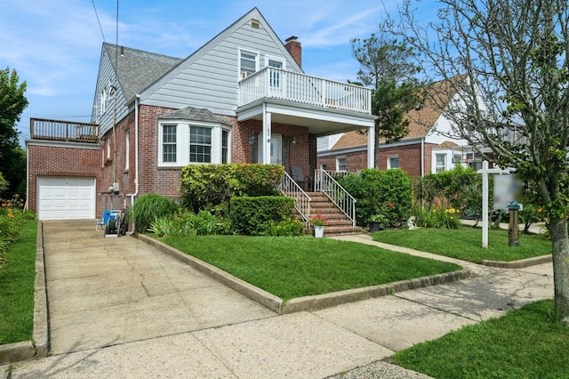 163 Lindell Blvd, Long Beach, NY 11561 - view of front of house featuring a balcony, brick siding, driveway, a front lawn, and a chimney