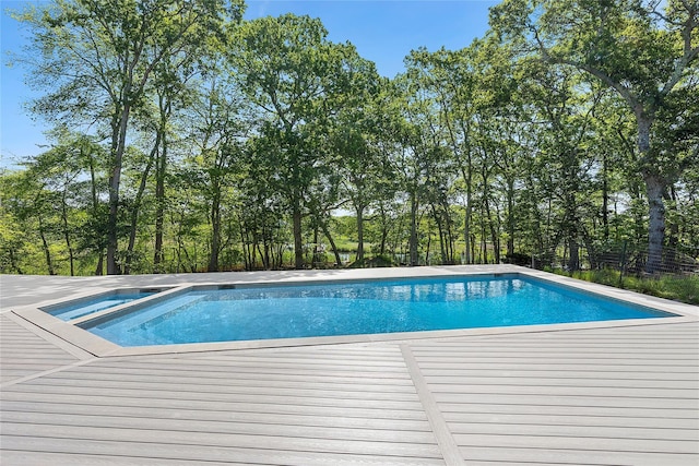 12 Plume Grass Way, Westhampton, NY 11977 - swimming pool featuring a wooden deck