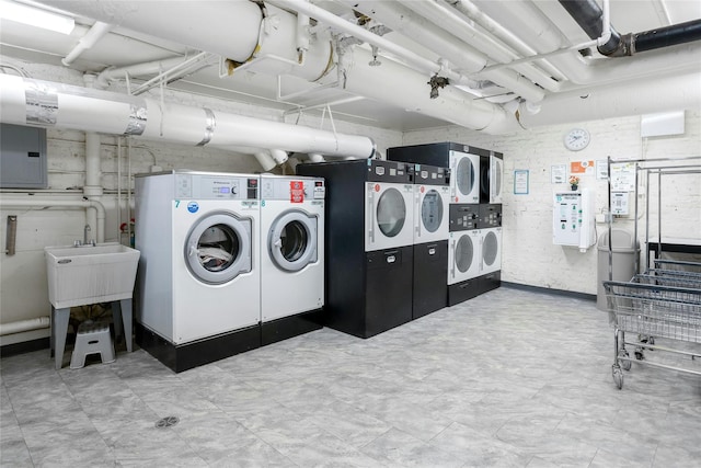 37 Central Ave Unit 2G, Hartsdale, NY 10530 - communal laundry room with independent washer and dryer, electric panel, and stacked washer / dryer