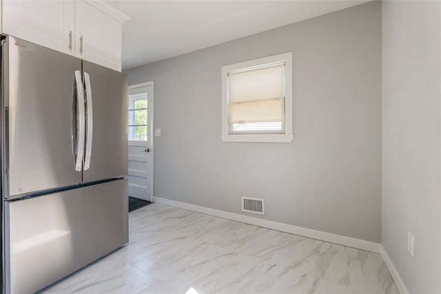 34 Klein Ave, West Nyack, NY 10994 - kitchen with freestanding refrigerator, light marble finish floors, and white cabinetry