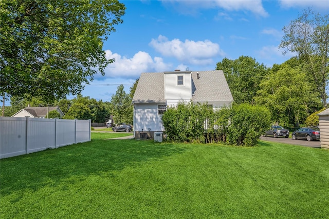 34 Klein Ave, West Nyack, NY 10994 - back of house with a chimney and roof with shingles