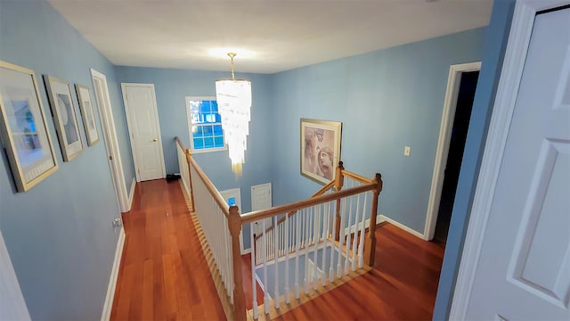 948 Orlando Ave, West Hempstead, NY 11552 - hall featuring an upstairs landing and wood finished floors
