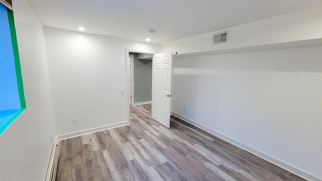 948 Orlando Ave, West Hempstead, NY 11552 - unfurnished bedroom with wood finished floors and recessed lighting
