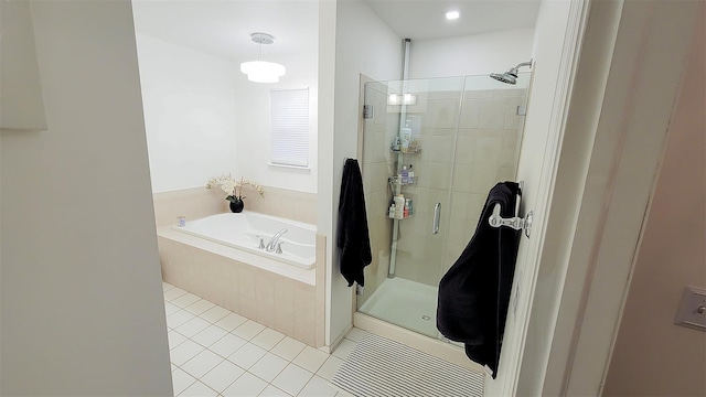 948 Orlando Ave, West Hempstead, NY 11552 - full bathroom featuring a shower stall, a garden tub, and tile patterned flooring