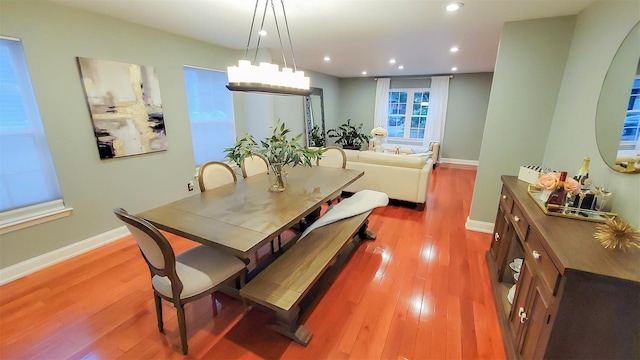 948 Orlando Ave, West Hempstead, NY 11552 - dining area with wood finished floors and recessed lighting