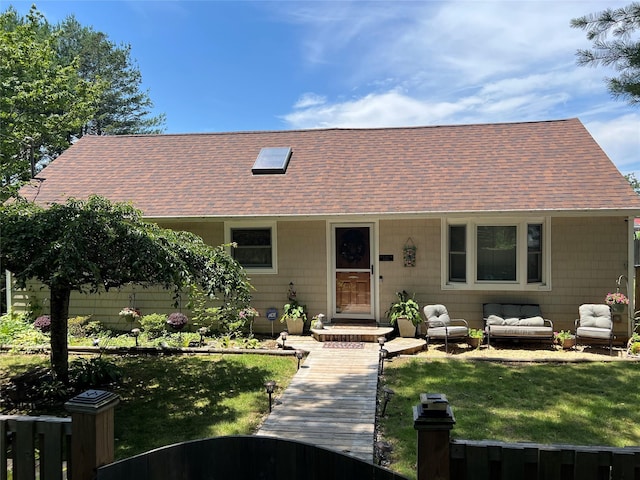 120 Lynbrook Dr, Brookhaven, NY 11951 - view of front facade featuring a shingled roof, a front yard, and an outdoor living space