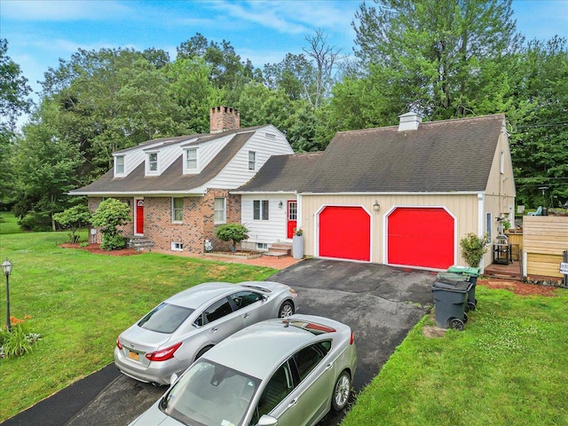 48 Eastview Rd, Highland Mills, NY 10930 - view of front of property featuring a chimney, an attached garage, asphalt driveway, roof with shingles, and a front lawn