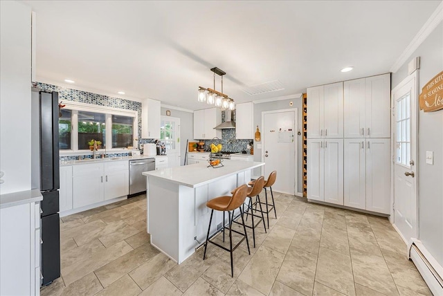 48 Eastview Rd, Highland Mills, NY 10930 - kitchen with dishwasher, a baseboard radiator, ornamental molding, wall chimney exhaust hood, and white cabinetry