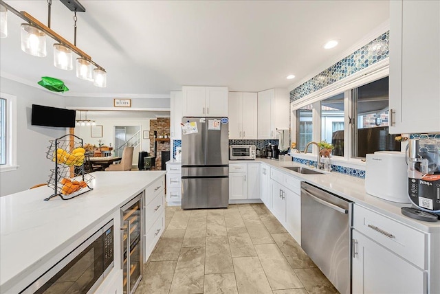 48 Eastview Rd, Highland Mills, NY 10930 - kitchen with appliances with stainless steel finishes, beverage cooler, healthy amount of natural light, tasteful backsplash, and recessed lighting