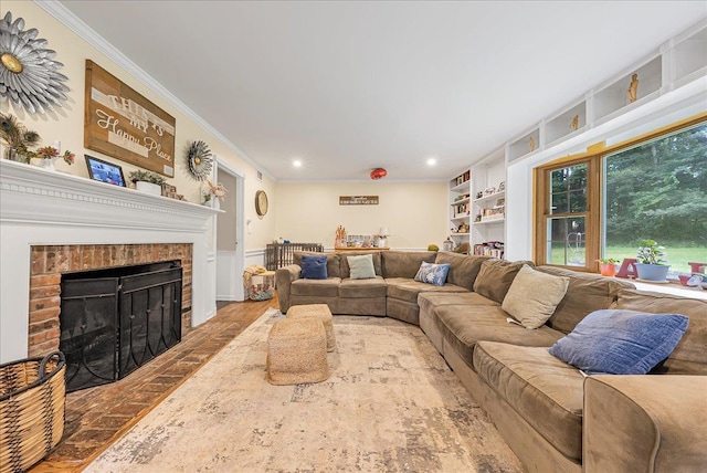 48 Eastview Rd, Highland Mills, NY 10930 - living area featuring ornamental molding, wood finished floors, recessed lighting, a brick fireplace, and wainscoting