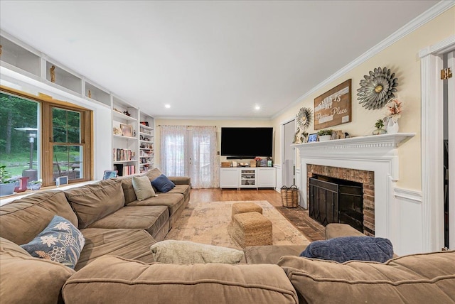48 Eastview Rd, Highland Mills, NY 10930 - living room featuring ornamental molding, a brick fireplace, wood finished floors, built in features, and recessed lighting