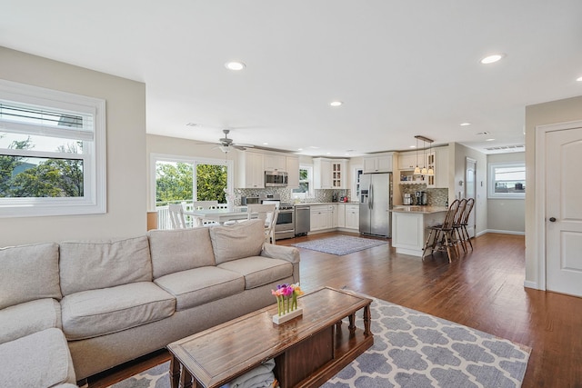 43 E Jackson Ave, Babylon, NY 11702 - living area with plenty of natural light, recessed lighting, dark wood finished floors, and a ceiling fan