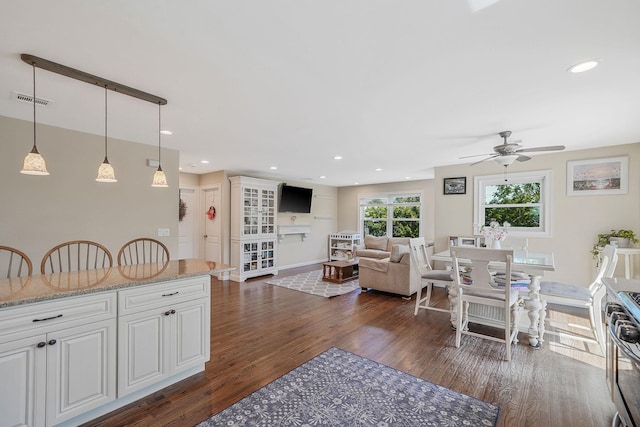 43 E Jackson Ave, Babylon, NY 11702 - dining area with dark wood finished floors, a ceiling fan, and recessed lighting