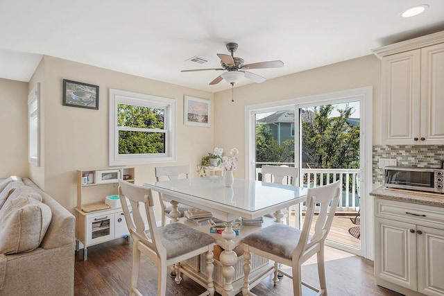 43 E Jackson Ave, Babylon, NY 11702 - dining area with plenty of natural light, ceiling fan, and dark wood-style floors