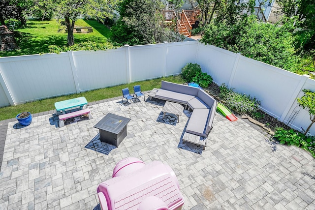43 E Jackson Ave, Babylon, NY 11702 - fenced backyard with a patio area and a fire pit