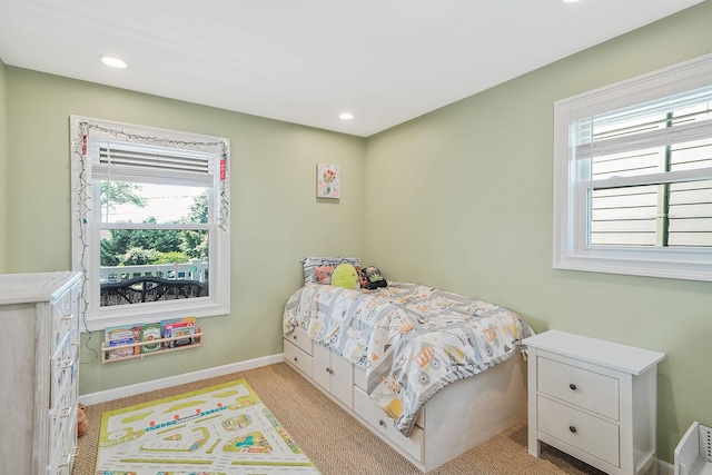 43 E Jackson Ave, Babylon, NY 11702 - bedroom featuring multiple windows, light colored carpet, and recessed lighting