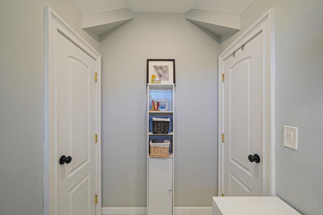 43 E Jackson Ave, Babylon, NY 11702 - hallway with baseboards and vaulted ceiling