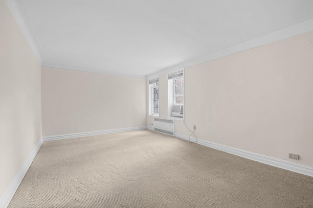 111-15 75th Ave Unit 4K, Forest Hills, NY 11375 - empty room with radiator heating unit, light carpet, ornamental molding, and cooling unit