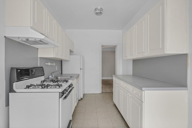 111-15 75th Ave Unit 4K, Forest Hills, NY 11375 - kitchen featuring white appliances, white cabinetry, under cabinet range hood, and light countertops