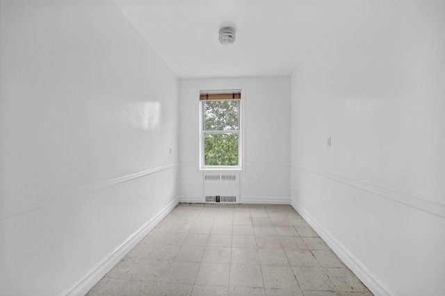 111-15 75th Ave Unit 4K, Forest Hills, NY 11375 - empty room featuring radiator and a smoke detector