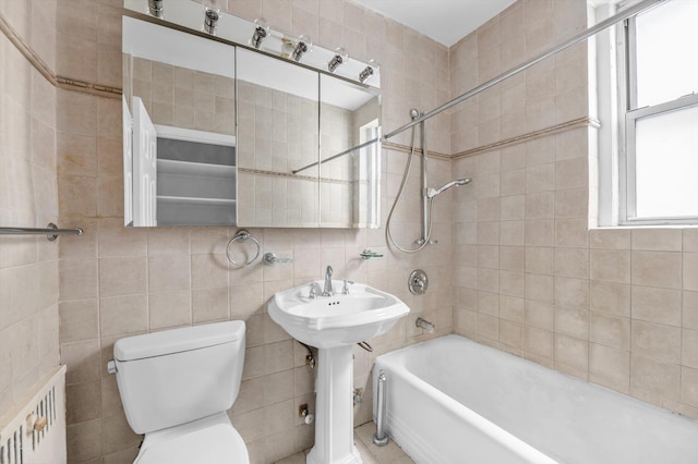 111-15 75th Ave Unit 4K, Forest Hills, NY 11375 - bathroom featuring tile walls, radiator, and washtub / shower combination