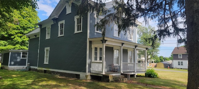 5-7 Myrtle Ave, Pine Plains, NY 12567 - view of side of home featuring a porch and a lawn