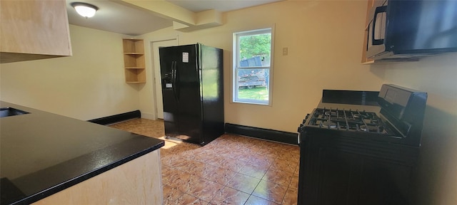 5-7 Myrtle Ave, Pine Plains, NY 12567 - kitchen with black appliances, dark countertops, and light brown cabinetry