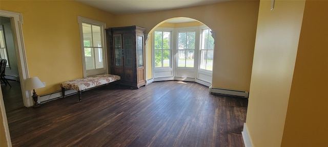 5-7 Myrtle Ave, Pine Plains, NY 12567 - foyer entrance featuring dark wood finished floors and a baseboard heating unit
