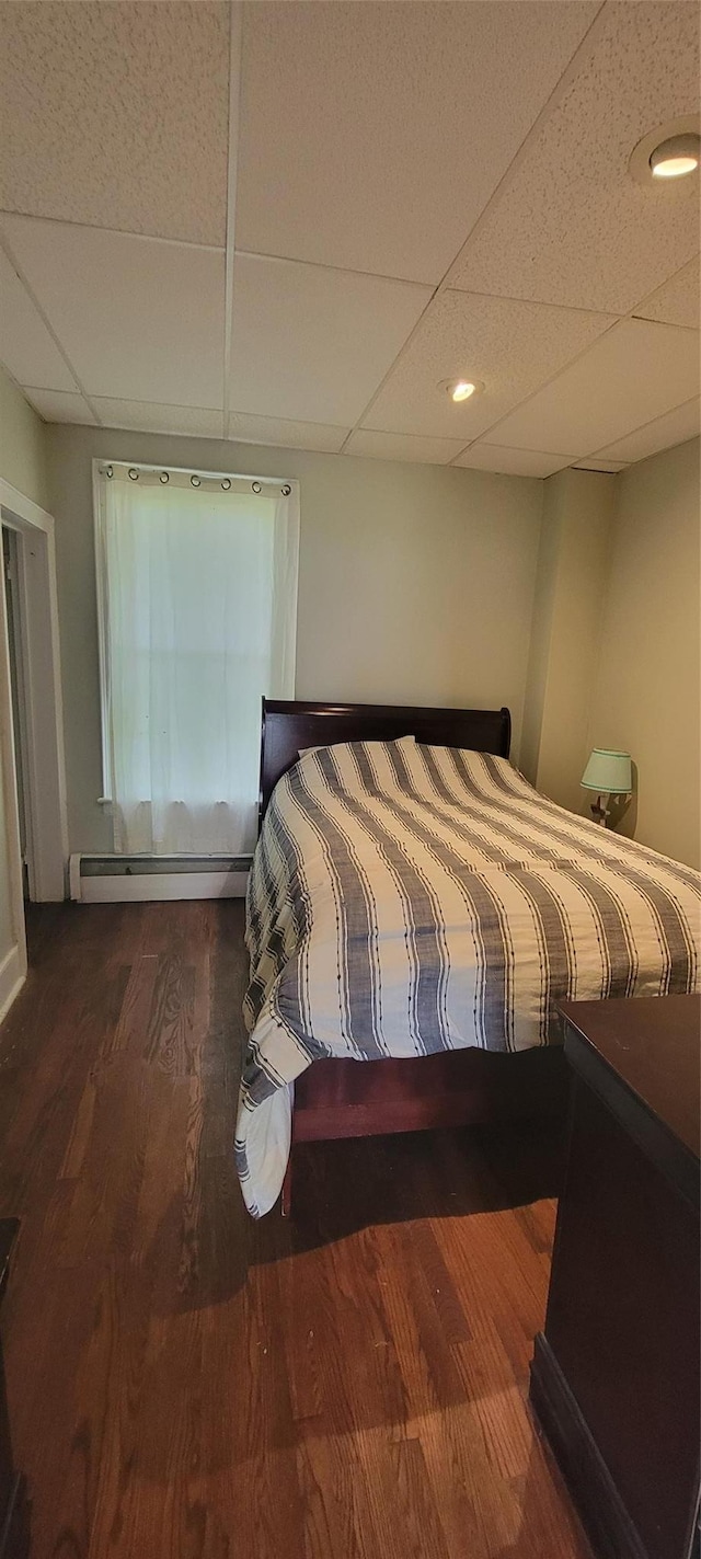 5-7 Myrtle Ave, Pine Plains, NY 12567 - bedroom featuring a baseboard radiator, a paneled ceiling, and wood finished floors