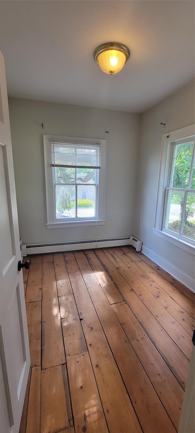 5-7 Myrtle Ave, Pine Plains, NY 12567 - unfurnished room with wood-type flooring and baseboard heating
