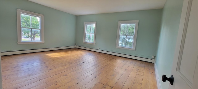 5-7 Myrtle Ave, Pine Plains, NY 12567 - unfurnished room with plenty of natural light, a baseboard heating unit, and wood-type flooring