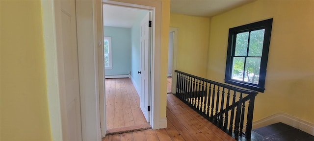5-7 Myrtle Ave, Pine Plains, NY 12567 - corridor featuring a baseboard radiator, an upstairs landing, hardwood / wood-style flooring, and plenty of natural light