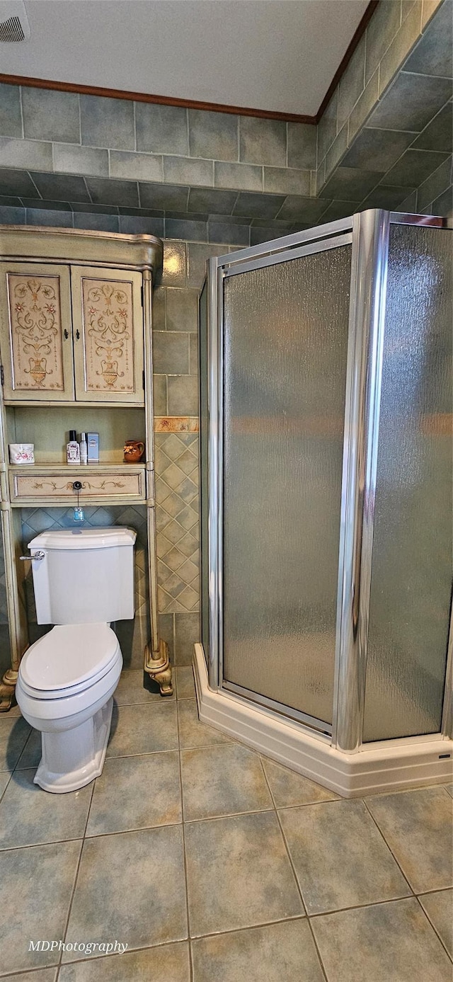 385 Oceanside Pkwy, Oceanside, NY 11572 - bathroom featuring a stall shower and tile patterned flooring