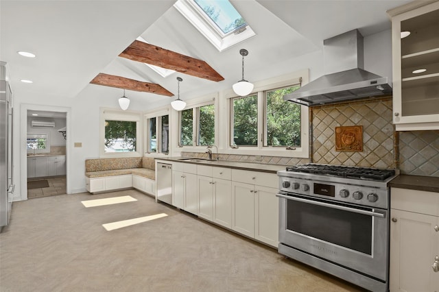 383 Pine Brook Rd, Bedford, NY 10506 - kitchen with appliances with stainless steel finishes, wall chimney range hood, a skylight, healthy amount of natural light, and recessed lighting
