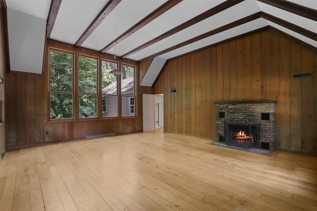 383 Pine Brook Rd, Bedford, NY 10506 - unfurnished living room featuring wooden walls, a brick fireplace, light wood-style flooring, and a baseboard heating unit