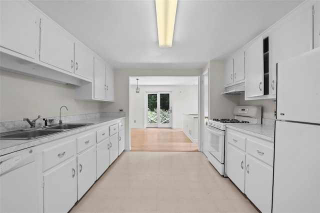 383 Pine Brook Rd, Bedford, NY 10506 - kitchen with white appliances, under cabinet range hood, light countertops, and white cabinetry