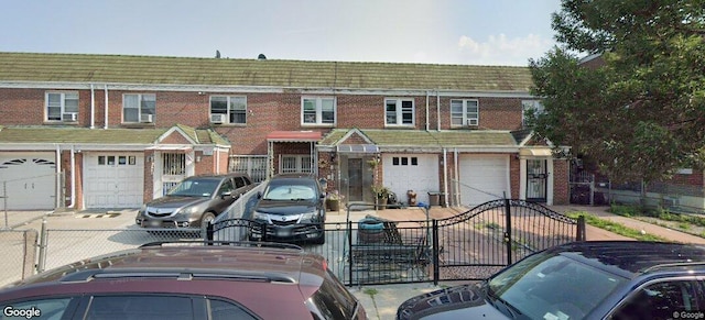 89-16 91st Ave, Woodhaven, NY 11421 - view of property featuring brick siding and an attached garage