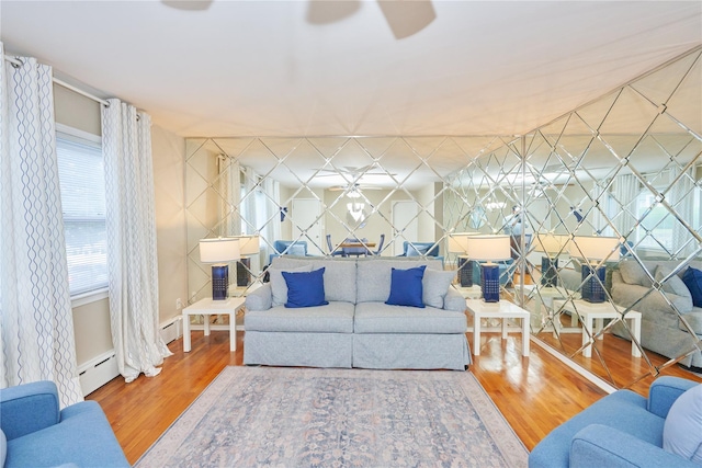 112 N Columbus Ave, Mount Vernon, NY 10553 - living room featuring a baseboard radiator, wood finished floors, and ceiling fan