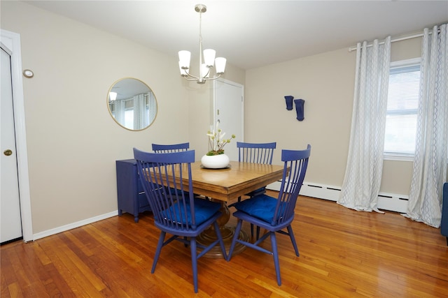 112 N Columbus Ave, Mount Vernon, NY 10553 - dining area featuring light wood-type flooring, a chandelier, and a baseboard radiator