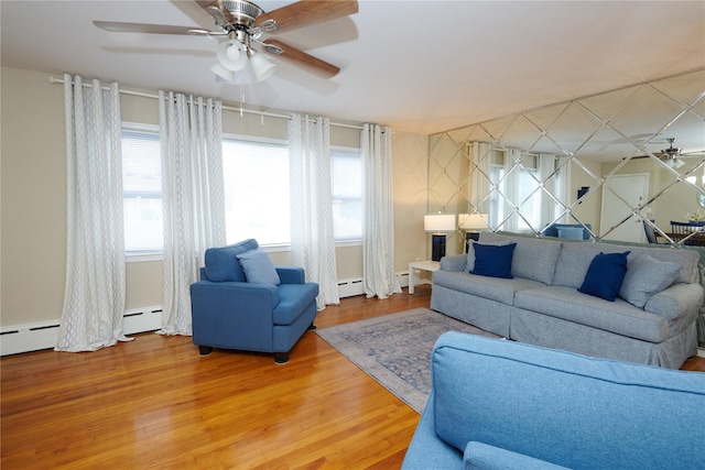 112 N Columbus Ave, Mount Vernon, NY 10553 - living area with a ceiling fan, a baseboard heating unit, and wood finished floors