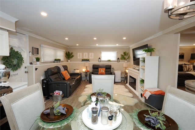 112 N Columbus Ave, Mount Vernon, NY 10553 - dining room featuring recessed lighting, crown molding, a glass covered fireplace, and light wood finished floors